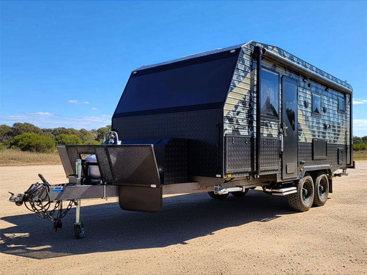 Off-road caravan with armoured-look exterior on Aussie gravel
